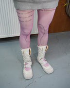 pink printed tights with white ballet boots