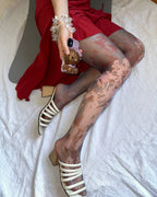 digital printed sheer tights with hello kitty phone case and paloma wool sandals
