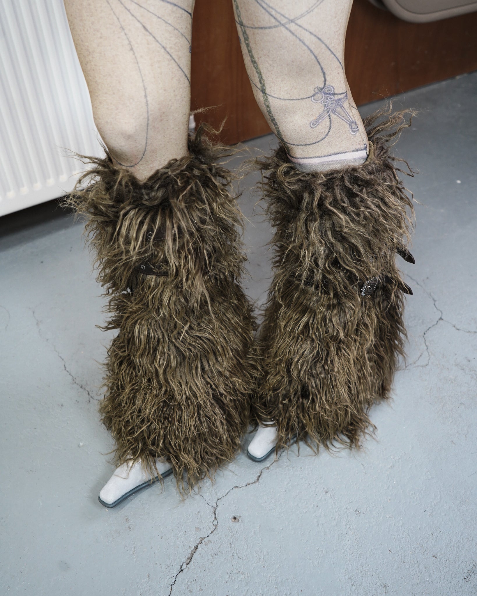 moss green leg warmers with tights and miumiu high heel sandals