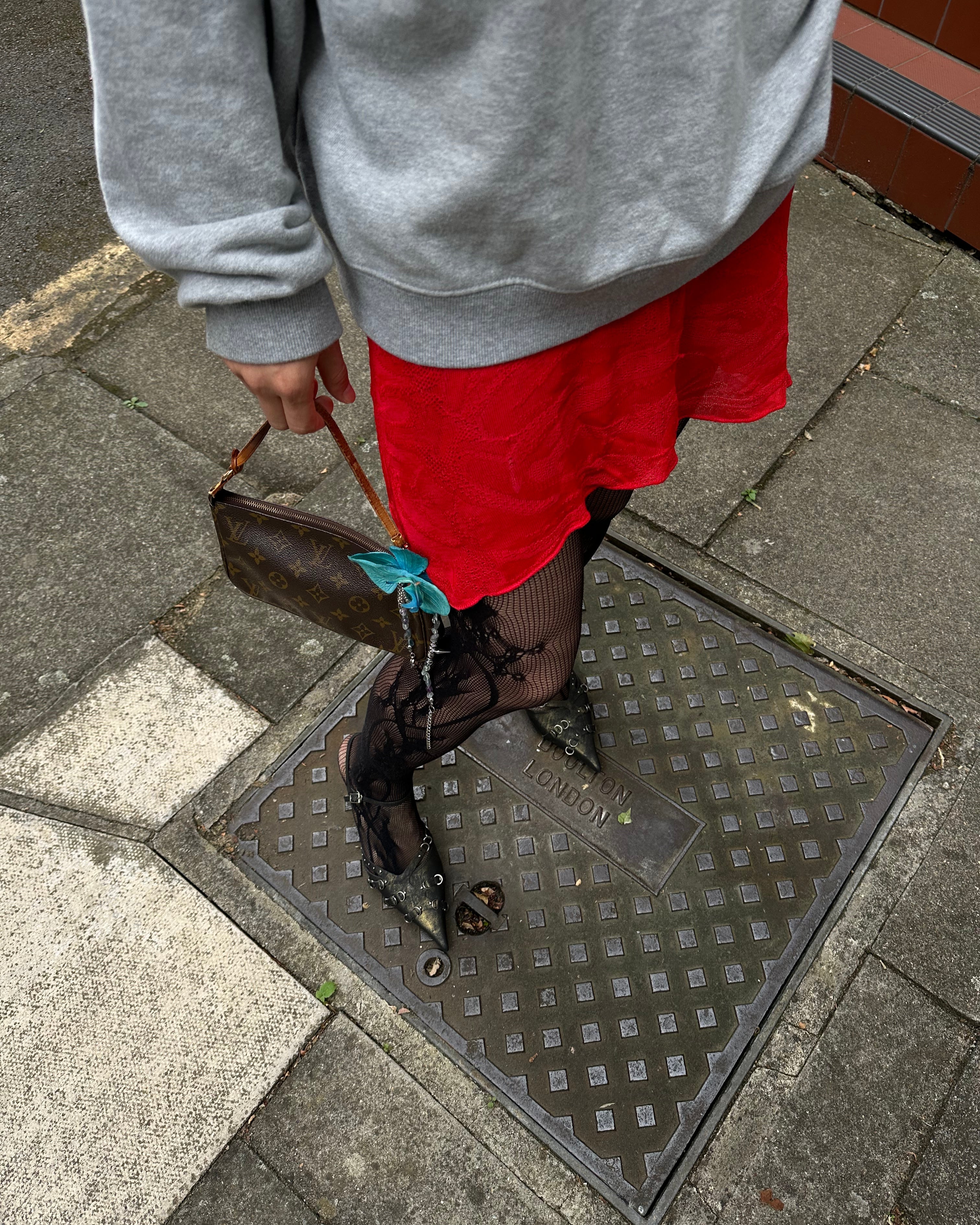 black lace tights with LV mini bag and gimaguas dress and grey hoodie
