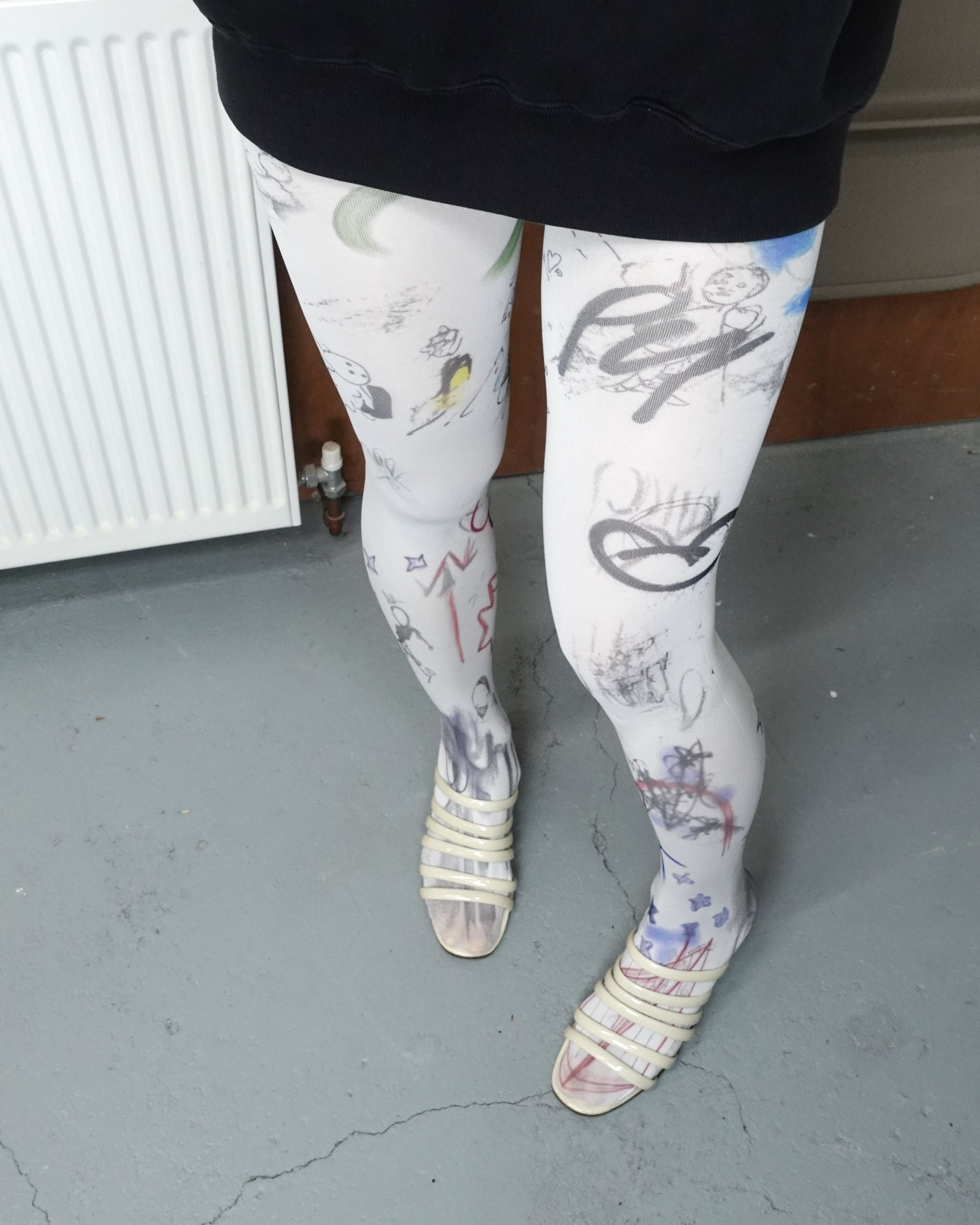 digital sketch printed sheer tights with paloma wool sandals close up