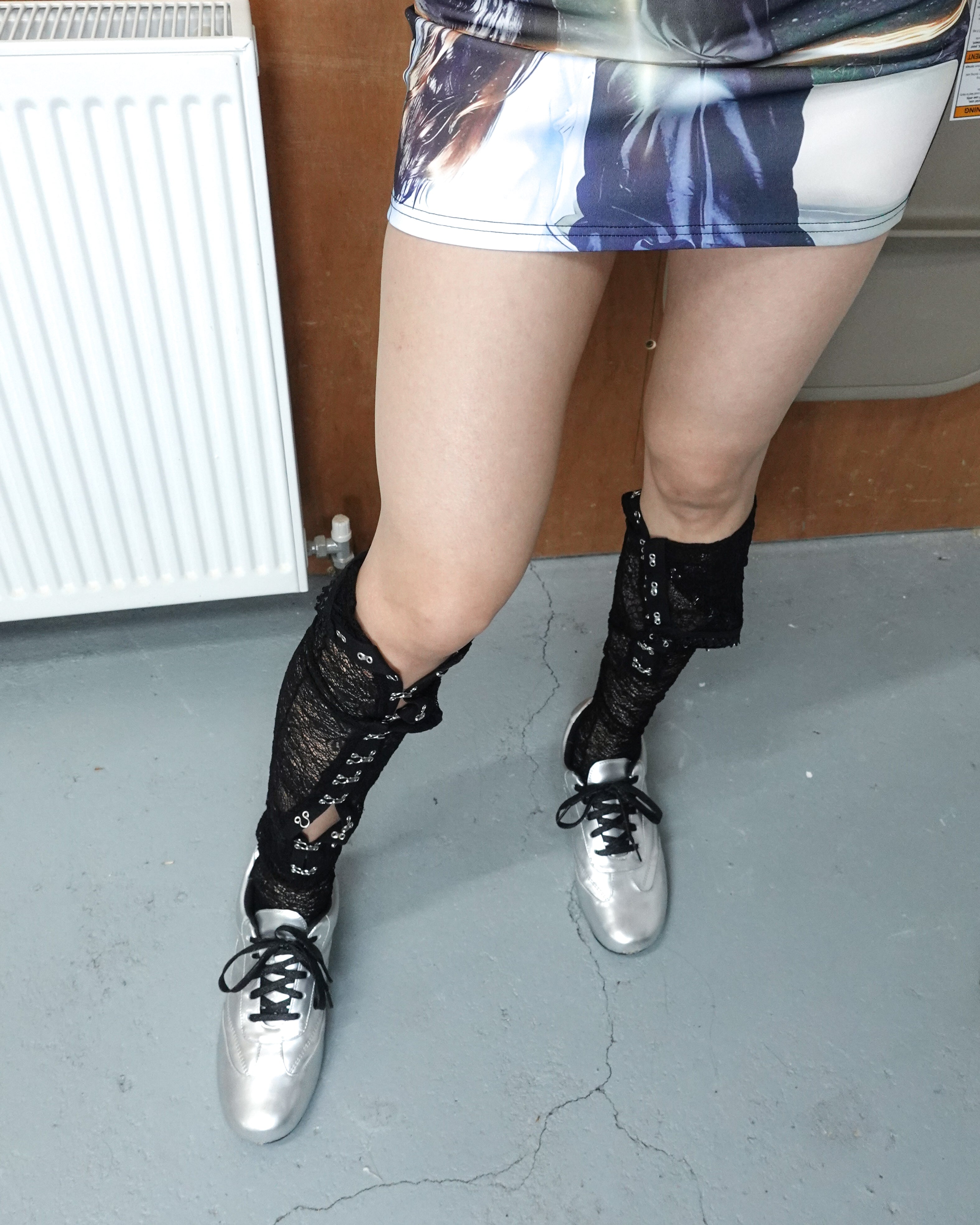 victorian mesh lace tights with silver kitten heel trainers and mini skirt