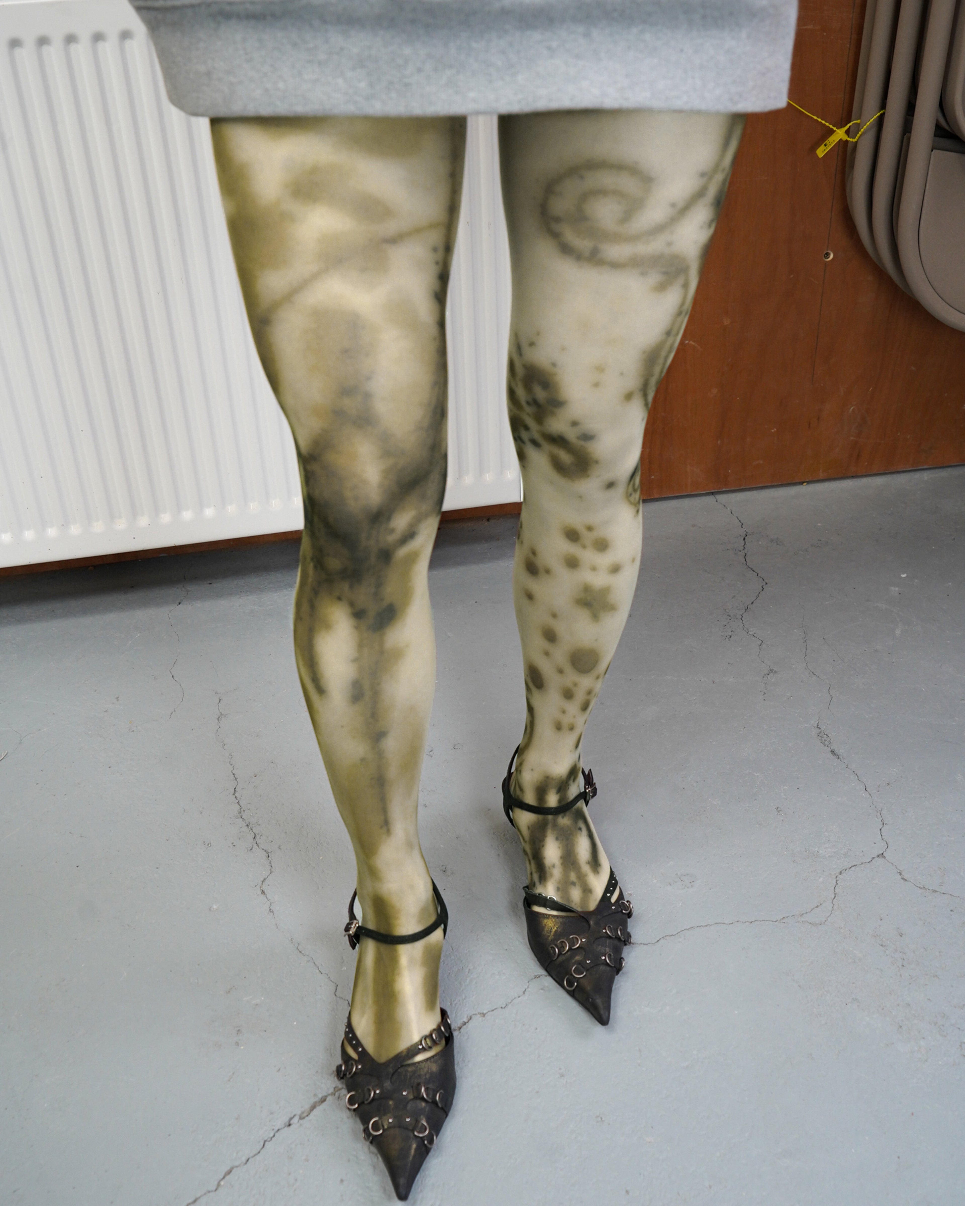 beige sheer tights on model with miumiu kitten heel sandals